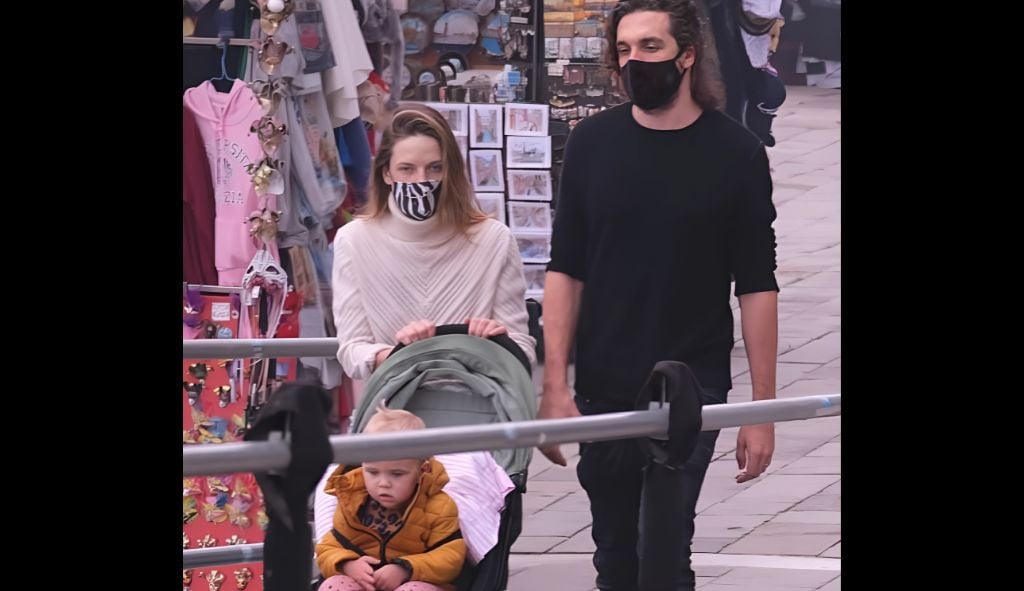 Rory St. Clair Gainer and family walking through a public area